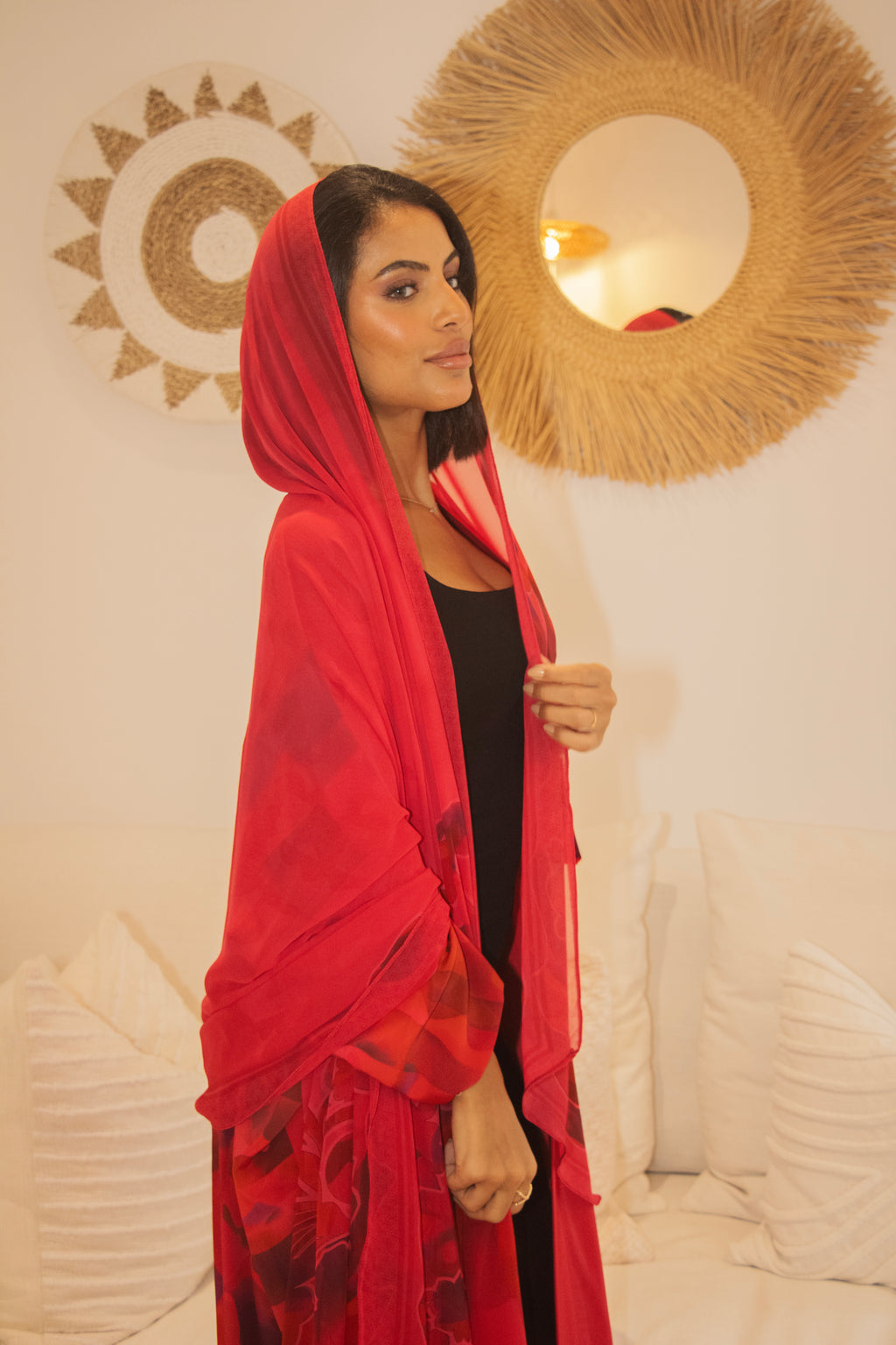 Side view of the PEONISA Crimson red set with matching scarf over a black top.