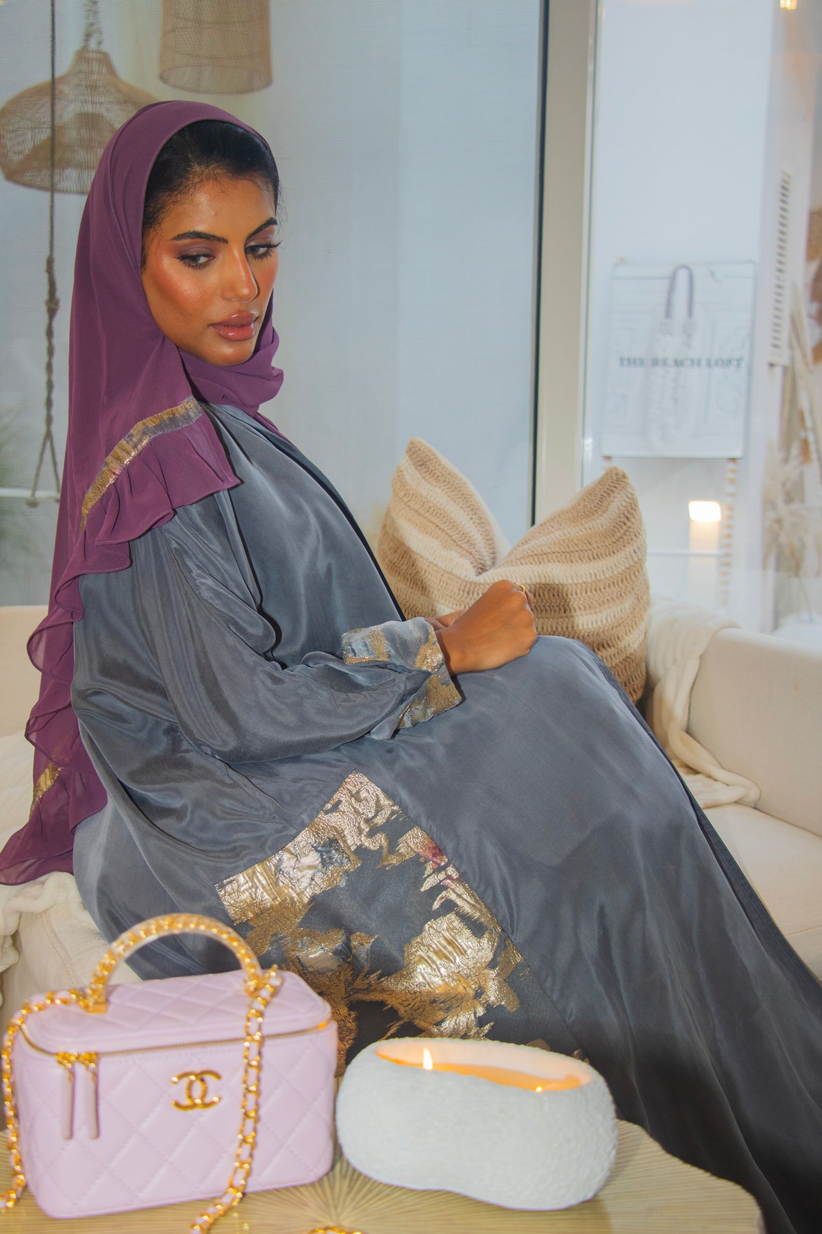 PEONISA Misk grey abaya with gold and soft pink embroidered details along the sleeve and side panel.
